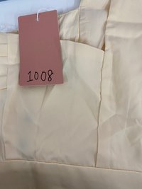 DEFECT | Perl Pleated Halter Jumpsuit in Pastel Yellow in XS DEFECT | Perl Pleated Halter Jumpsuit in Pastel Yellow in XS