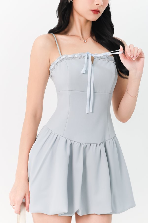 BACKORDER | Brenna Bubble Hem Tie Romper Dress in Light Blue