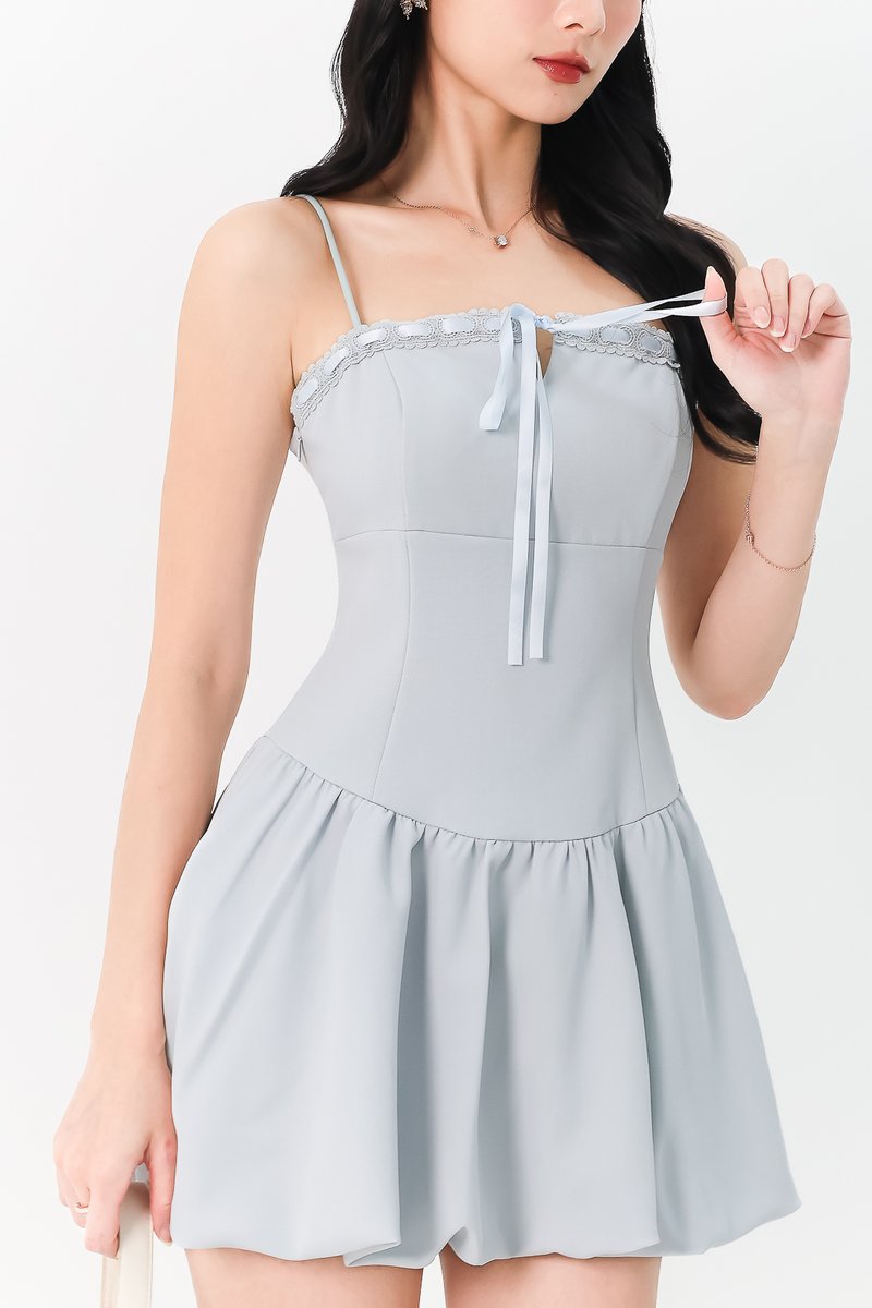 RESTOCKS | Brenna Bubble Hem Tie Romper Dress in Light Blue