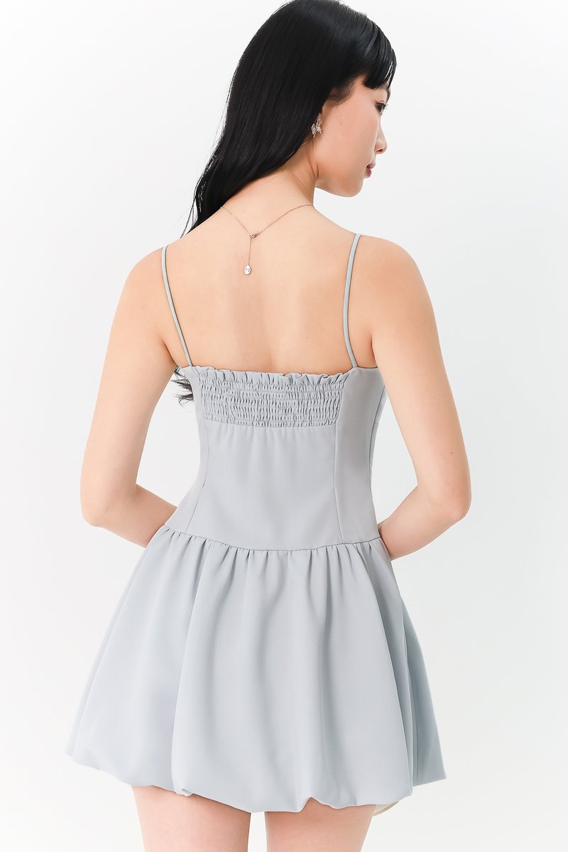 RESTOCKS | Brenna Bubble Hem Tie Romper Dress in Light Blue