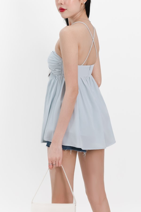 Tenla Twist Knot Cross Back Babydoll Top in Ice Blue