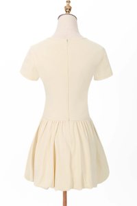 Serla Sleeved Bubble Romper Dress in Pastel Yellow