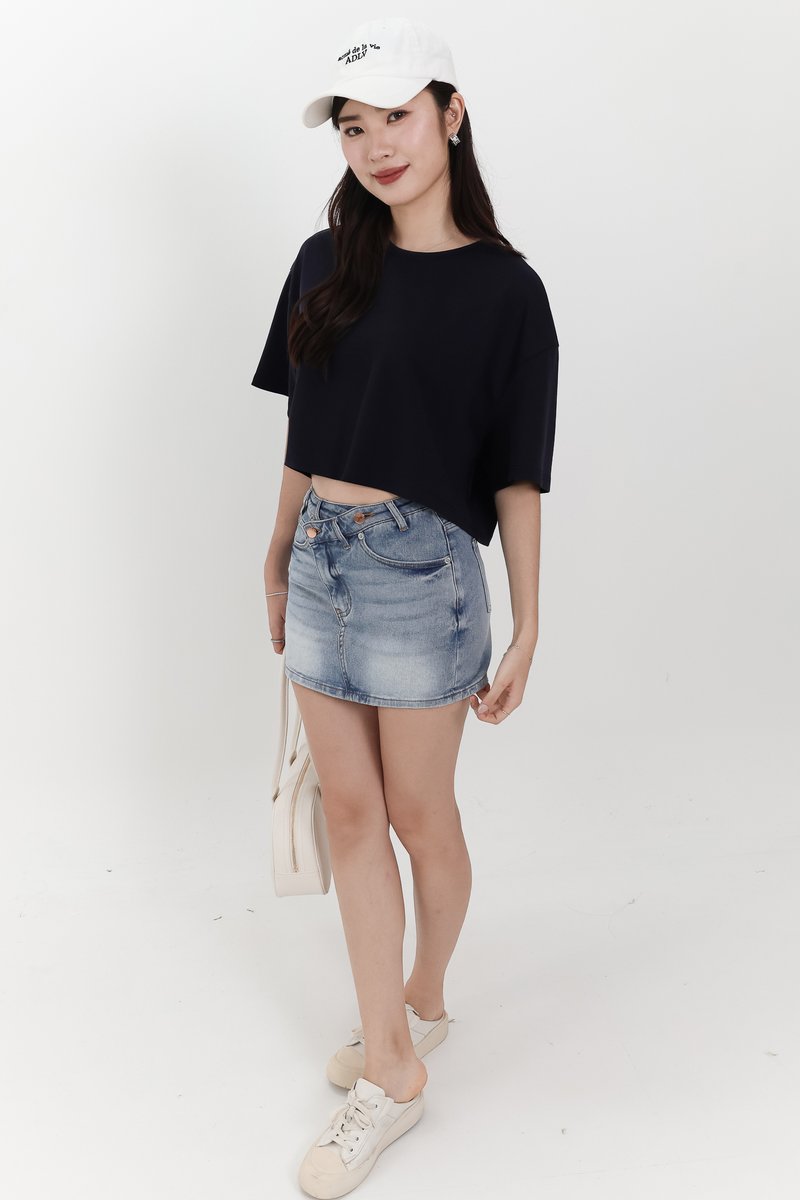 Audrey Asymmetrical Mid Waist Denim Skorts in Light Wash
