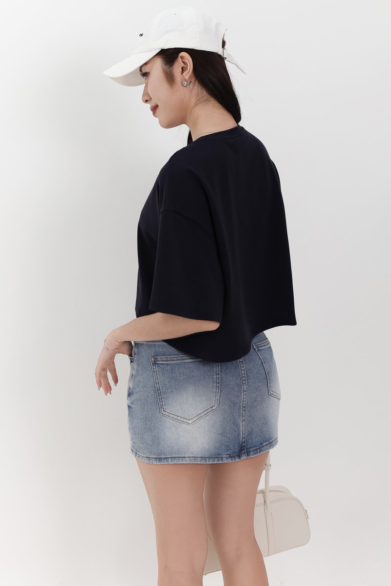 Audrey Asymmetrical Mid Waist Denim Skorts in Light Wash