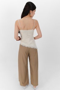 Avelyn Asymmetrical Lace Trim Top in Light Champagne