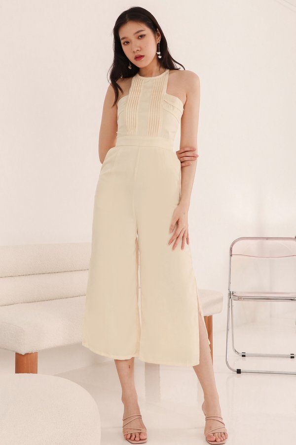 DEFECT | Perl Pleated Halter Jumpsuit in Pastel Yellow in XS